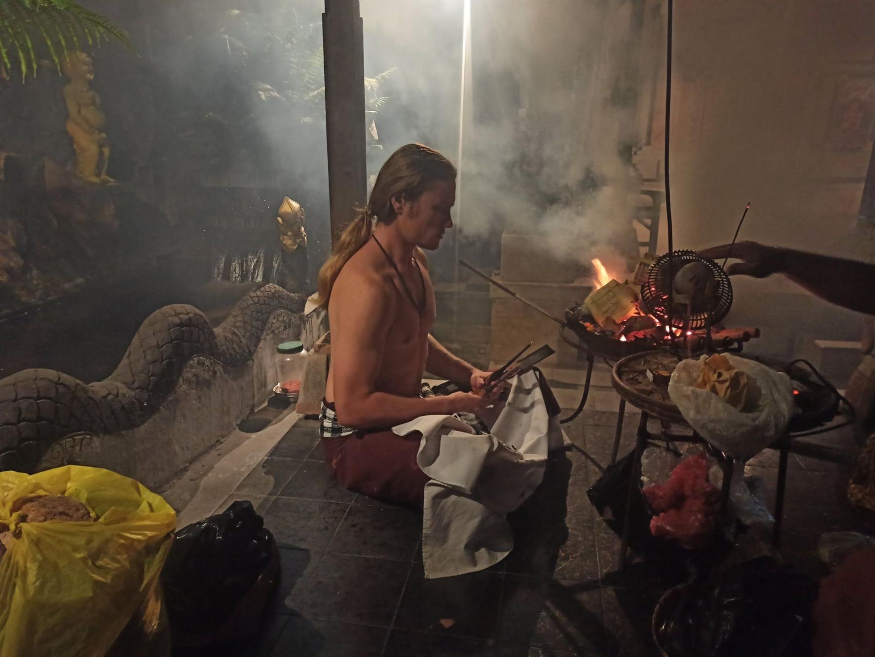 Igor seated by a ceremonial fire, surrounded by smoke